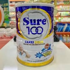 Sữa Sure 100 - Canxi Gold T/12 lon 900g (người lớn)